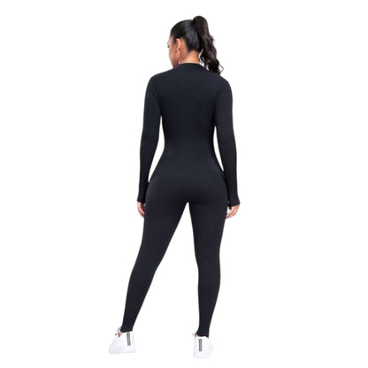 Woman wearing a black seamless zipper front long-sleeve jumpsuit, showcasing the back view for activewear style.