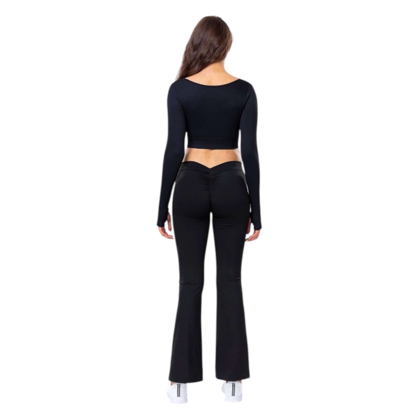 Back view of a model wearing a black square neck crop top with twist knot design and flared pants, perfect for workouts.