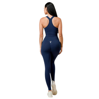 Back view of a woman wearing a blue body contouring activewear set, designed for a flattering fit and maximum comfort.